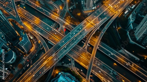 An aerial drone view of elevated roads and traffic junctions, illustrating urban planning and traffic management in modern cities #764312878
