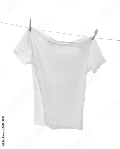 One t-shirt drying on washing line isolated on white