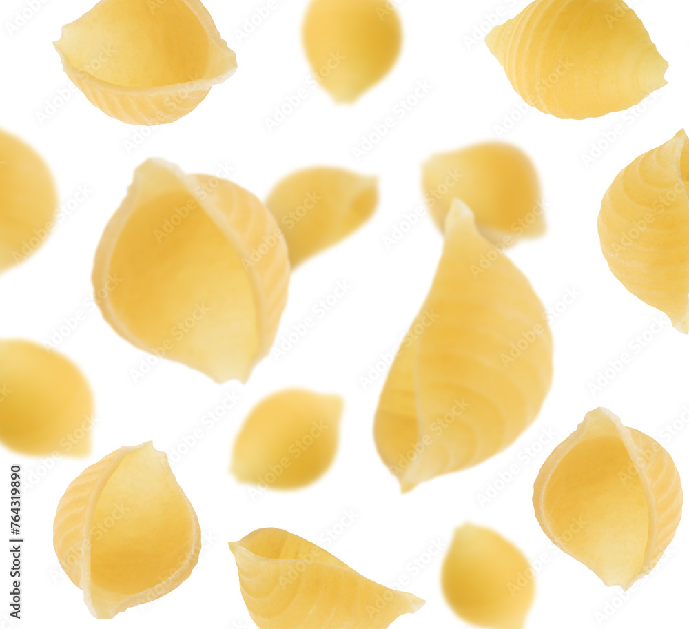Raw conchiglie pasta flying on white background Raw conchiglie pasta flying on white background