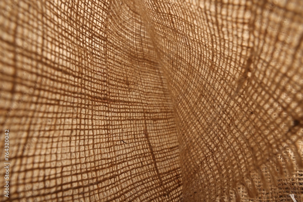 Fototapeta premium Texture of natural burlap fabric as background, closeup