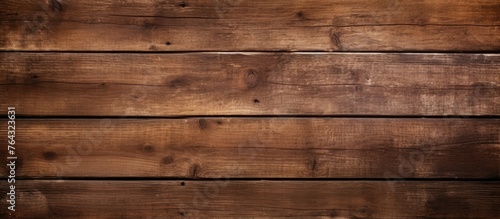 An image showing a detailed view of a wooden wall that has been stained with a brown color
