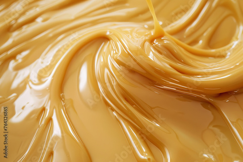 smooth texture of liquid melted caramel cream, poured onto the surface
