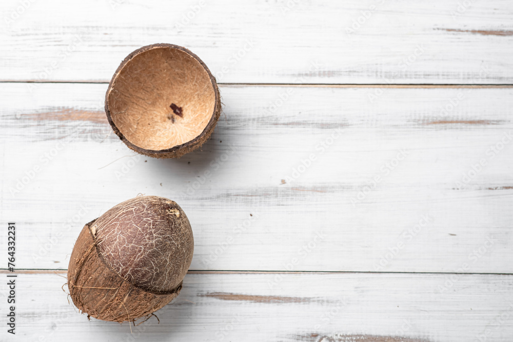Two coconuts are on a white background