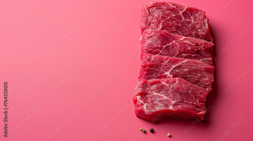 Fototapeta premium A piece of meat is cut into thin strips on a pink background, AI