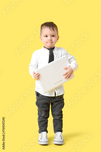 Cute little businessman wit...