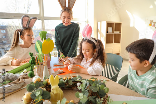 Little children in bunny ea...