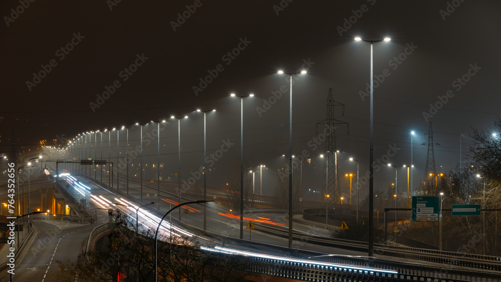 A night view of Kwiatkowski estacade with blurred car lights - Gdynia - obrazy, fototapety, plakaty 