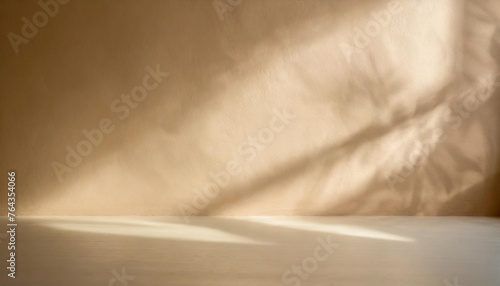 Minimalistic abstract Beige  wall background for product presentation with sunlight shadow. © anandart