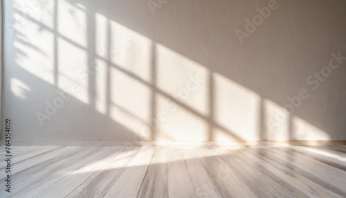 Minimalistic abstract light grey wall background for product presentation with sunlight shadow.