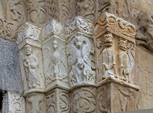 bassorilievi del portale sinistro della Basilica di San Michele a Pavia photo
