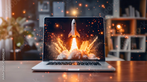 Rocket launch from laptop on office table to fly up in air. Business startup new idea project development, internet marketing strategy growth, future product progress on a website, speed power boost photo