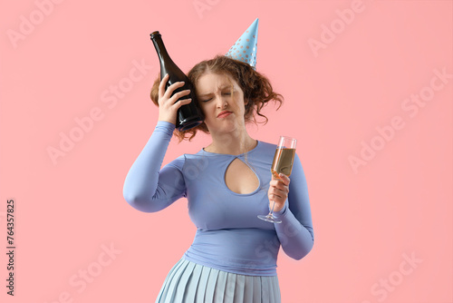 Young woman with hangover a...