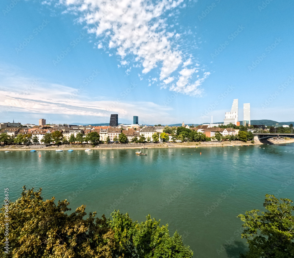Aerial view of the beautiful European city of Basel, Switzerland. The Rhine River is in the forefront of view. Major pharmaceutical company buildings can be seen in the distance.
