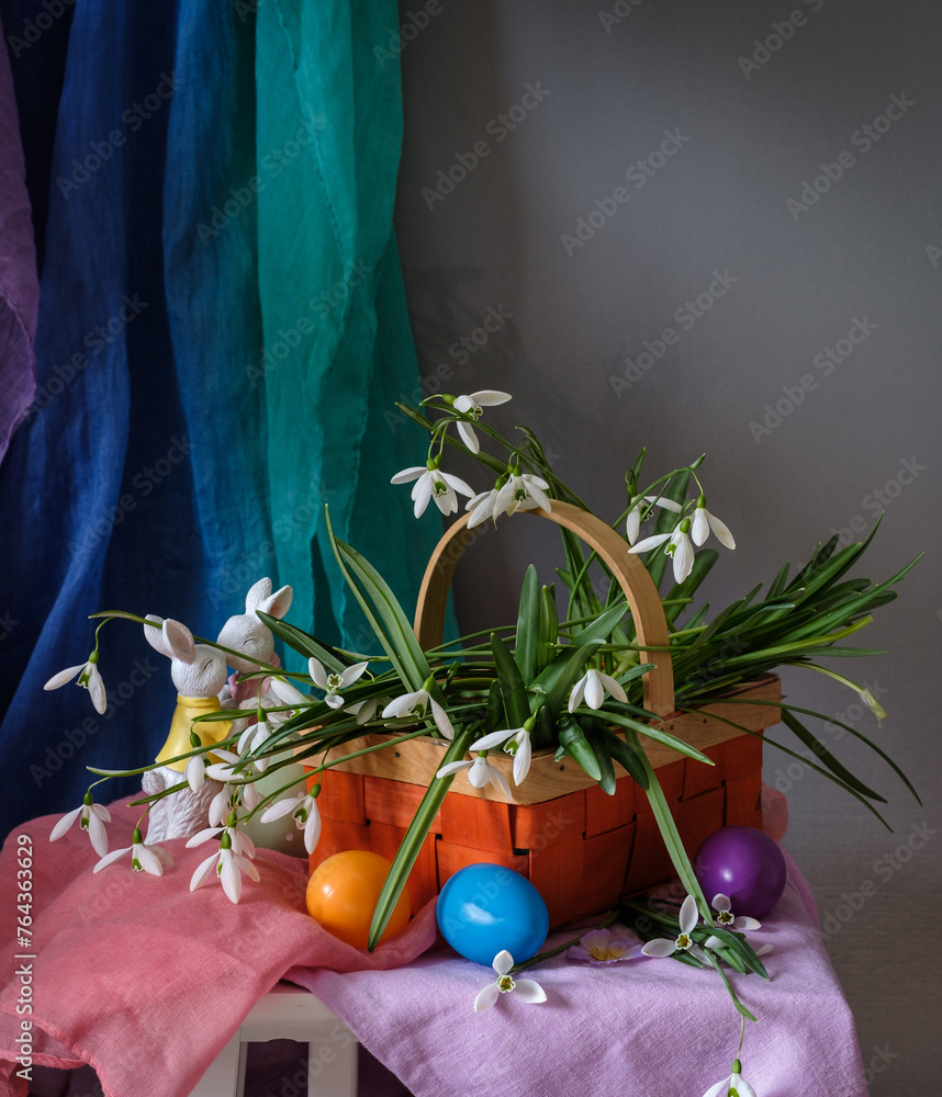 A still life arrangement of Easter eggs, spring flowers. Still life with snowdrops and ester eags.