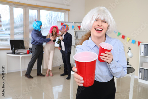 Business woman with cups ce...