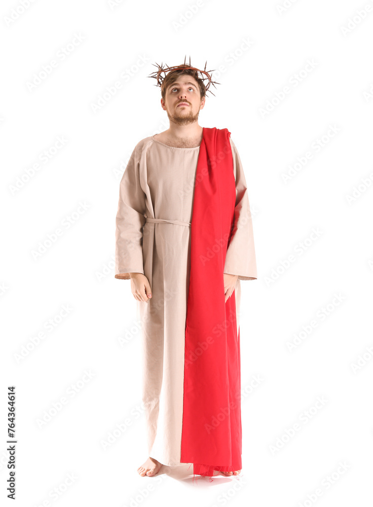 Man in Jesus robe and crown of thorns on white background Man in Jesus robe and crown of thorns on white background