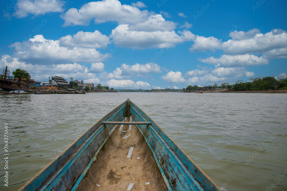 Blue wooden boat and Atrato river in Choco, Colombia.