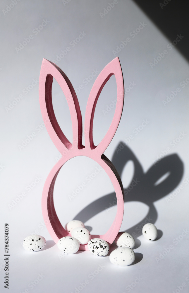 Fototapeta premium pink easter rabbit shadow with eggs