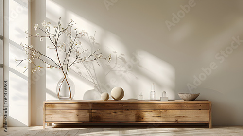  Minimalist composition of living room interior with copy space, wooden sideboard, glass vase with branch, bowl, ball sculpture and personal accessories