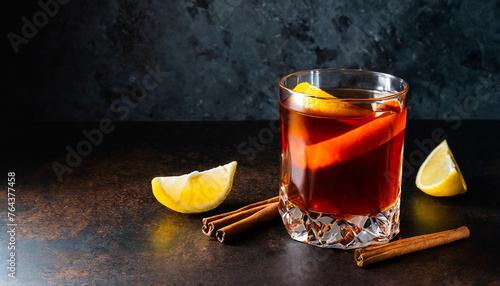 sazerac cocktail drink with lemon garnish in glass photo