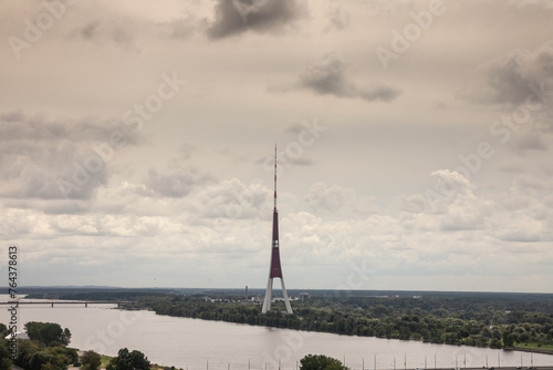 Panorama of the Daugava river seen from above with the riga radio and tv tower in Riga, latvia. Also called rigas radio un televizijas tornis, it's a broadcasting antenna and a landmark. photo