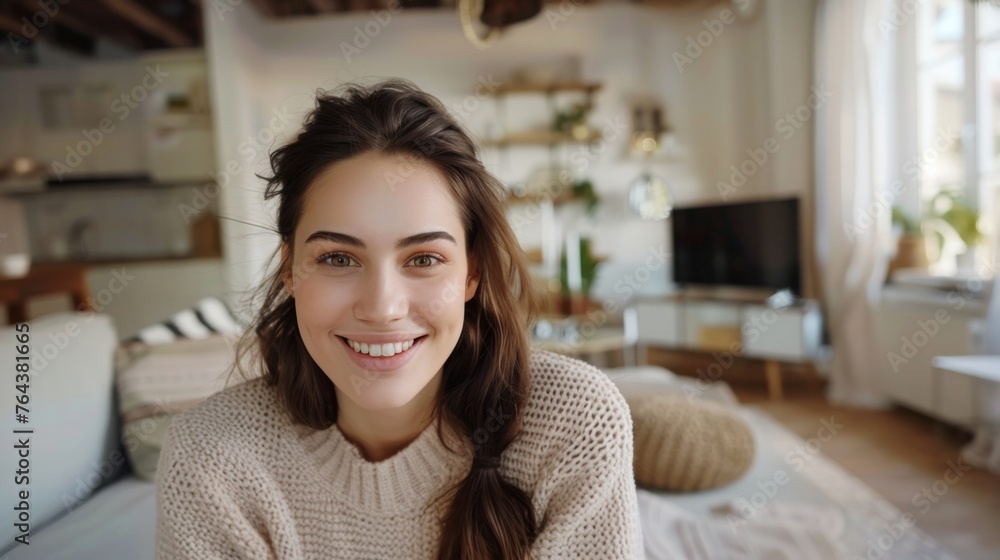 Woman is taking a selfie in her apartment Woman is taking a selfie in her apartment