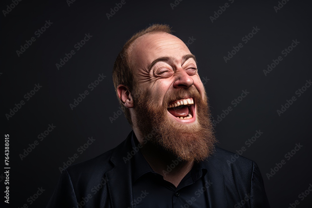 Portrait of a bearded man screaming with closed eyes on black background Portrait of a bearded man screaming with closed eyes on black background