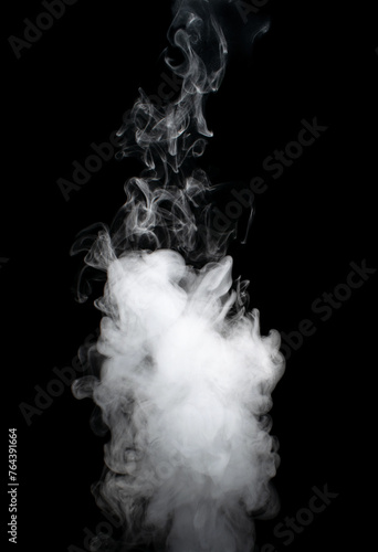 White puffs of smoke on a black background float mixing in bizarre chaotic patterns of thin threads