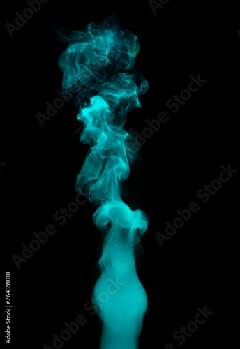 Chaotic mixing smoke creates abstract patterns on a black background