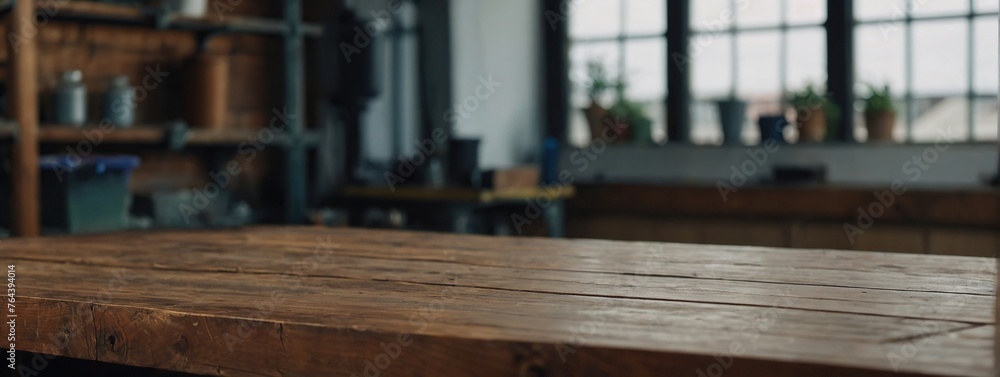 Wooden table top with copy space with blurred Workshop background Wooden table top with copy space with blurred Workshop background