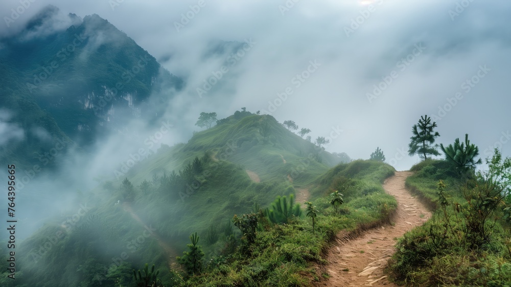 A serene path winding through a misty, lush green mountain landscape