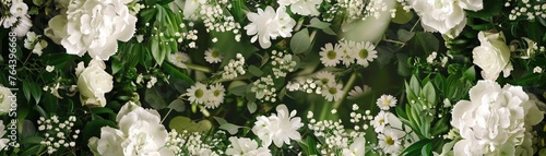 A Chic wedding photo booth background framed with lush white flowers and greenery