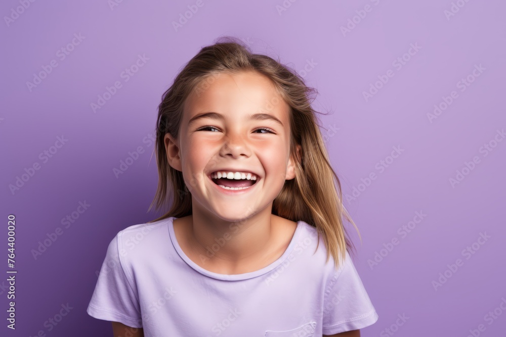 Portrait of a cute little girl smiling on a purple background. Portrait of a cute little girl smiling on a purple background.