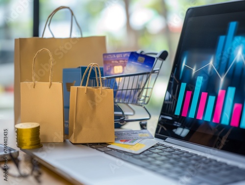 Purchasing shopping bags in a cart, using a credit card on a laptop, placing paper boxes on a table, and viewing an economic growth graph with sales data on a screen depicting e-commerce photo