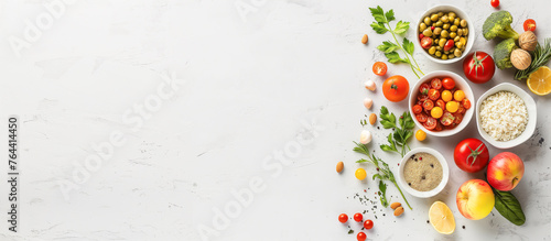 A white background with a variety of fruits and vegetables in bowls