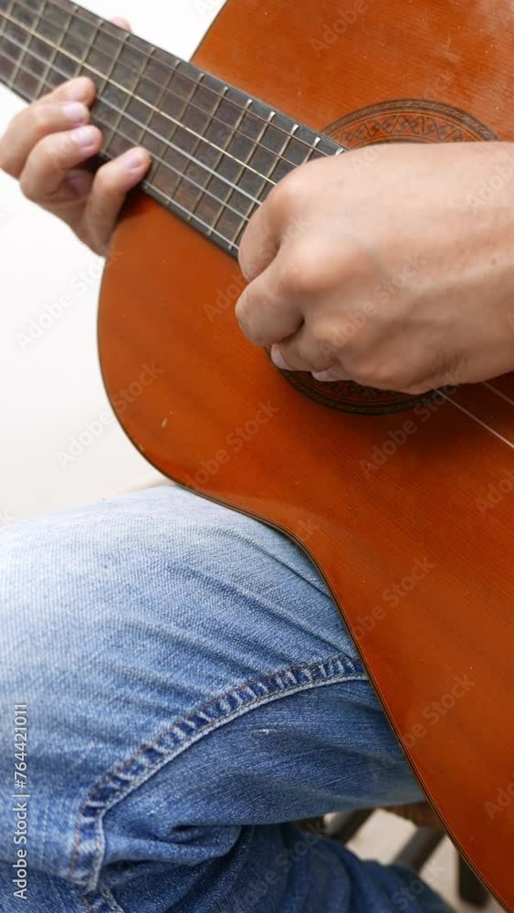 Vidéo Stock Closeup shot of a man playing acoustic guitar. A musician