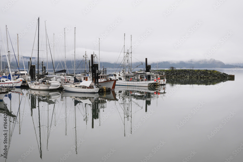 Boats docked at the Fishermen's Wharf during a winter season on Vancouver Island in Cowichan Bay, British Columbia, Canada