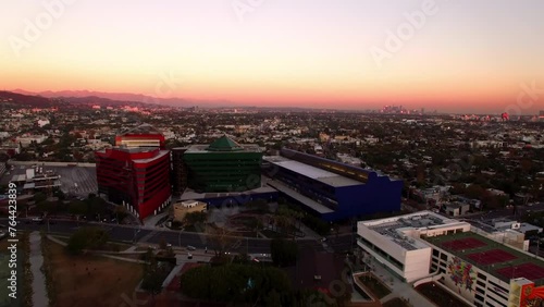 Aerial Shot Of Famous Pacific Design Center Garage Building In City Against Orange Sky, Drone Flying Backwards During Sunset - West Hollywood, California photo