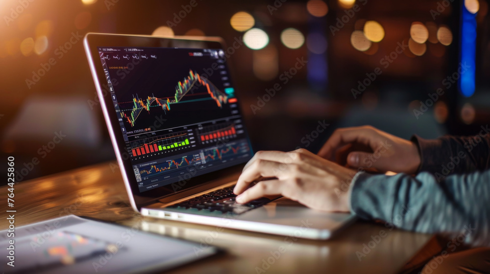 A laptop displaying a stock market graph. Scene is serious and focused, as the person using the laptop is likely analyzing the stock market data A laptop displaying a stock market graph. Scene is serious and focused, as the person using the laptop is likely analyzing the stock market data