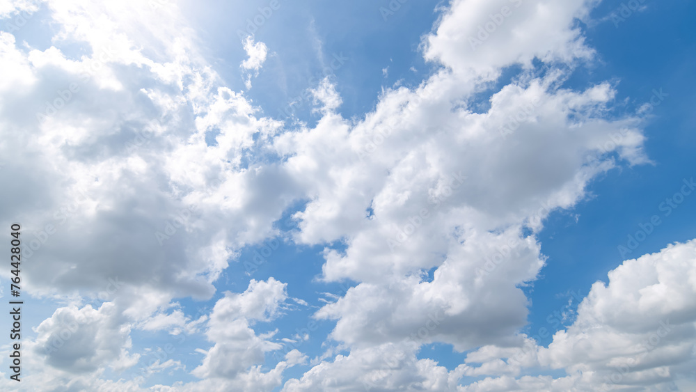 Panoramic view of clear blue sky and clouds, Blue sky background with tiny clouds. White fluffy clouds in the blue sky. Captivating stock photo featuring the mesmerizing beauty of the sky and clouds. Panoramic view of clear blue sky and clouds, Blue sky background with tiny clouds. White fluffy clouds in the blue sky. Captivating stock photo featuring the mesmerizing beauty of the sky and clouds.