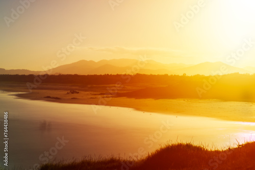 Landscape evening view golden sunset over the river with beautiful seen and background. Beauty and nature concept. Coffs Harbour’s, Australia. 