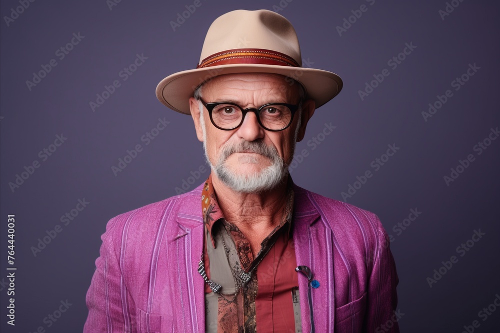 Handsome senior hipster man with hat and glasses. Studio shot. Handsome senior hipster man with hat and glasses. Studio shot.