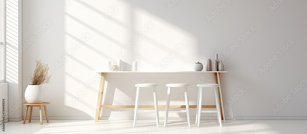 A simple white room with a desk and two chairs, creating a minimalist and clean interior design concept - obrazy, fototapety, plakaty 