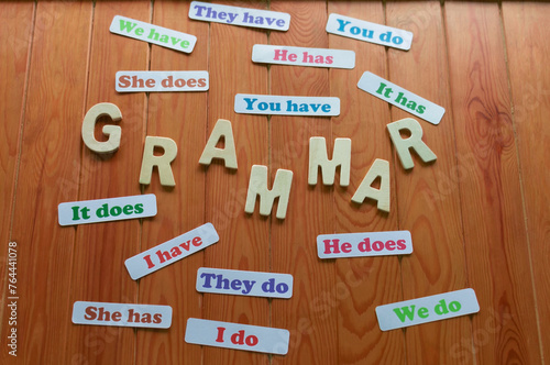 English grammar cards on wooden table