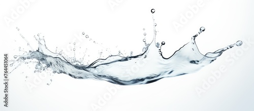 An energetic water splash captured in mid-air against a clean white background, highlighting the fluid dynamics of the motion
