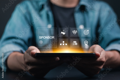 Sponsorship concept. Business between fund sponsors Resources or services. Businessman showing sponsor icon on virtual screen. photo