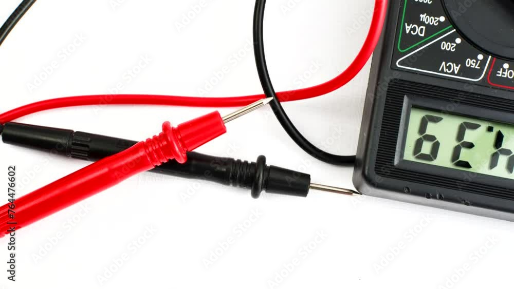 Close-up of a multimeter on a clear surface, highlighting precision and versatility for electrical measurements. Close-up of a multimeter on a clear surface, highlighting precision and versatility for electrical measurements.