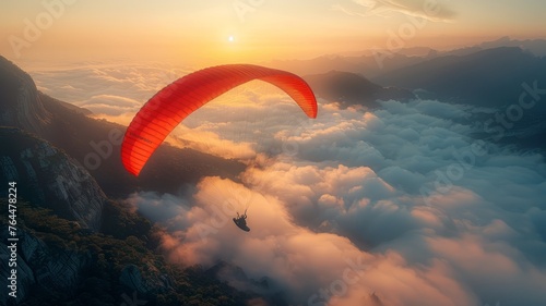a paraglider gliding peacefully above the clouds photo