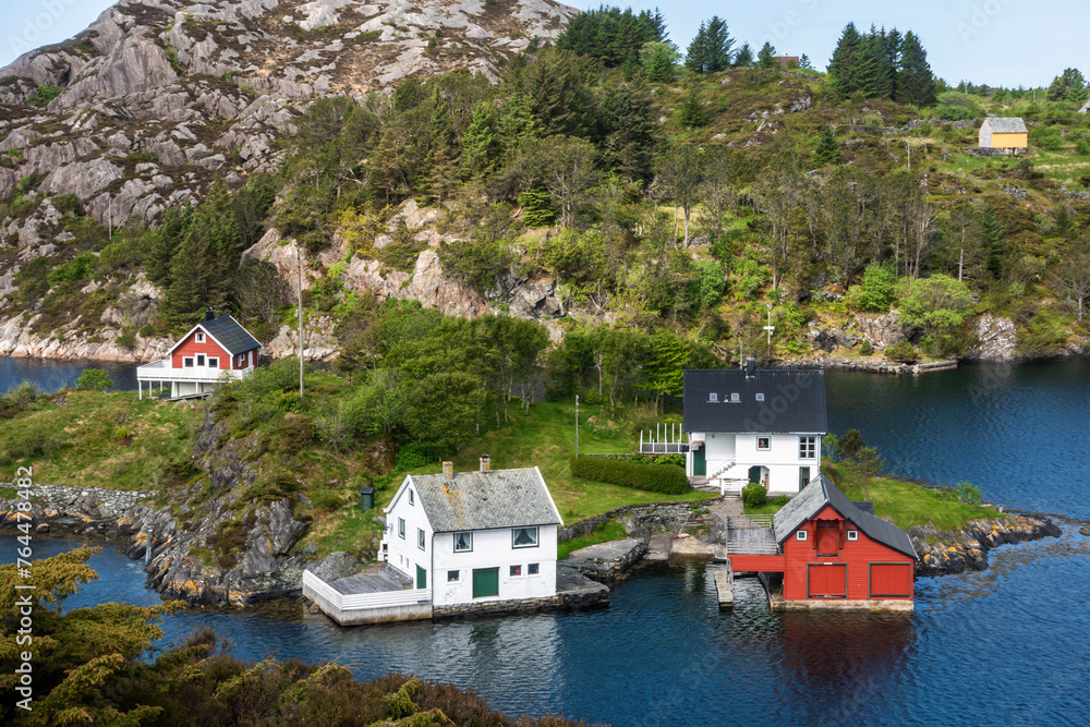 scenic aerial view of an old fashioned fishing village with colorful homes on the coastline of Norway Scandinavia