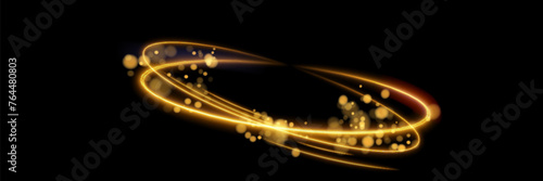Magical light effect. Rotating luminous ellipses. Dynamic golden rings on black background.